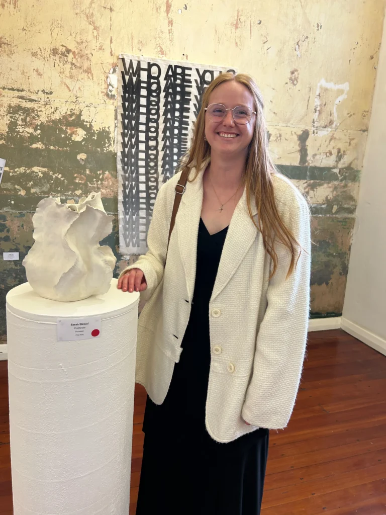 Sarah Stroud next to Proliferate sculpture at Bird Street Gallery